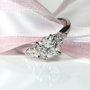 Cushion Cut Ring with Pear Shape Side Diamonds